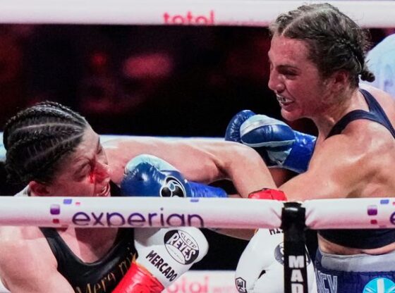 England's Ellie Scotney, left, punches Mexico's Yamileth Mercado during the eighth round of a super bantamweight boxing match Friday, July 11, 2025, in New York. (AP Photo/Frank Franklin II)