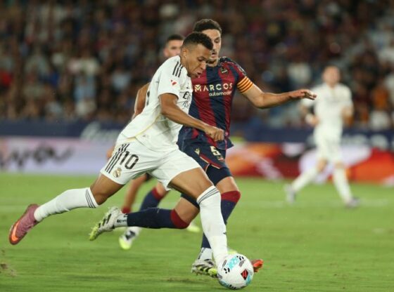 Real Madrid's Kylian Mbappe score hits sides third goal during the Spanish La Liga soccer match between Levante and Real Madrid at the Ciutat de Valencia stadium in Valencia, Spain, Tuesday, Sept. 23, 2025. (AP Photo/Alberto Saiz)