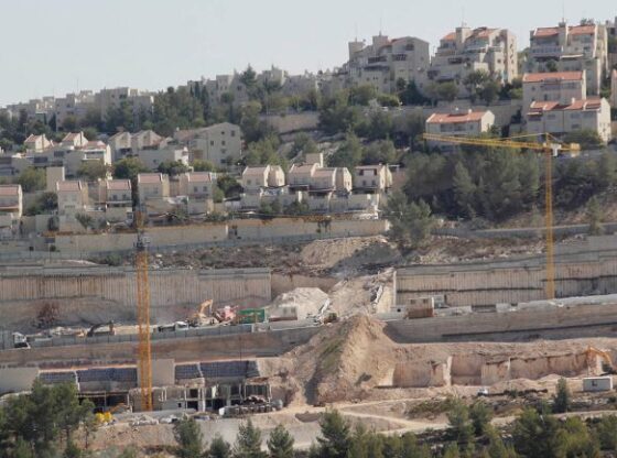 Atef Daghlas - Settlement construction continues on the lands of Al-Walaja village between Jerusalem and Bethlehem, where the occupation aims to connect the settlements there with a wide road network - West Bank - Bethlehem - Al-Walaja - Al Jazeera Net 3 copy.jpg