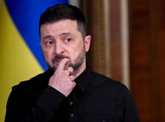 Ukraine's President Volodymyr Zelensky reacts at a joint press-conference.