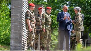 German Chancellor Friedrich Merz speaks with soldiers in the so-called Forest of Remembrance after his visit to the Operational Command of the German Armed Forces (Bundeswehr) in Schwielowsee, near Berlin, Germany, on June 28, 2025.