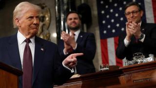 Vice President JD Vance and House Speaker Mike Johnson applaud Trump during his speech to Congress on March 4, 2025.