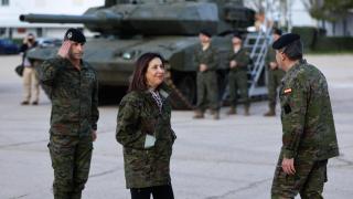 The Minister of Defense, Margarita Robles greets her upon arrival at the 'El Goloso' military base.