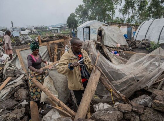 People who were displaced by the fighting between M23 rebels and government soldiers prepare to leave their camp following an instruction by M23 rebels in Goma, Democratic Republic of the Congo, Tuesday, Feb. 11, 2025. (AP Photo/Moses Sawasawa)