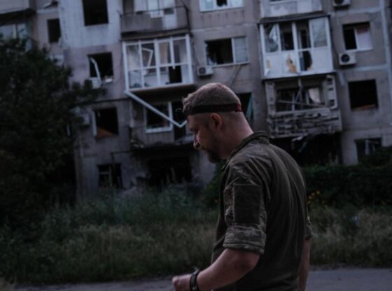 A Ukrainian soldier walks through the besieged city of Myrnograd (Pokrosvk front), where he has his combat position.