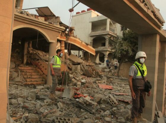 Rescuers inspect the site of an Israeli airstrike that targeted the southern Lebanese village of Tayr Debba on November 6, 2025.2025.
