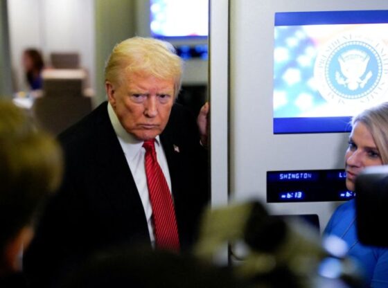 U.S. President Donald Trump looks on as he speaks to members of the media on board Air Force One en route to Joint Base Andrews, U.S., November 2, 2025. REUTERS/Elizabeth Frantz
