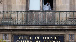 The scientific police work in a room of the Louvre Museum,