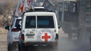 Red Cross vehicles transport a body, identified by Hamas as that of deceased Israeli soldier Hadar Goldin, in Deir al-Balah, central Gaza Strip, on November 9, 2025.