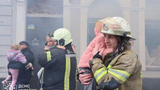 Rescuers evacuate children from the kindergarten hit by a Russian drone attack, in the midst of Russia's offensive against Ukraine, in Kharkiv.