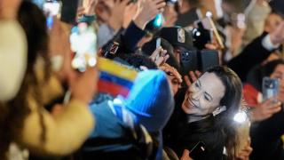 María Corina Machado greets her supporters at the Grand Hotel in Oslo, Norway, on December 11, 2025.
