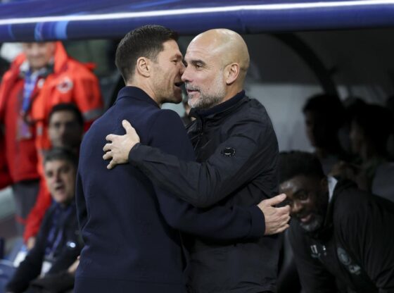 Xabi Alonso and Guardiola greet each other before the match.
