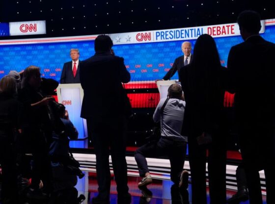 Photographers take photos of President Joe Biden, right, and Republican presidential candidate former President Donald Trump, left, during a break in a presidential debate hosted by CNN, Thursday, June 27, 2024, in Atlanta. (AP Photo/Gerald Herbert)